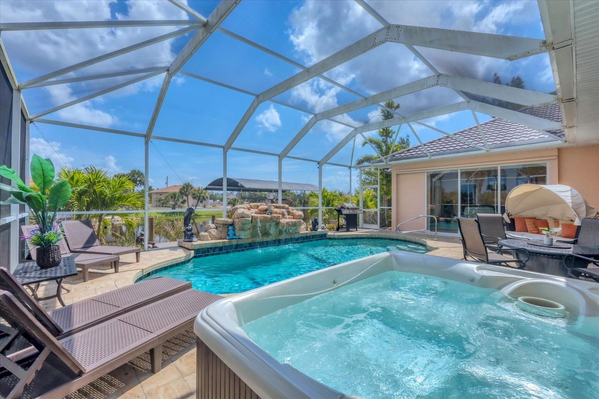 Beautiful South Gulf Cove home with private pool, hot tub, and canal access