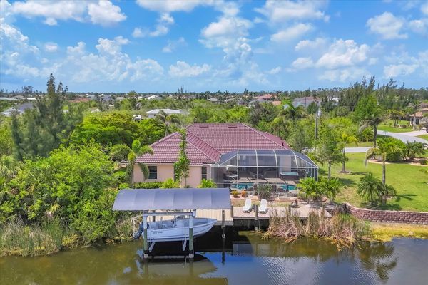 Beautiful South Gulf Cove home with private pool, hot tub, and canal access (Boat lift not available)