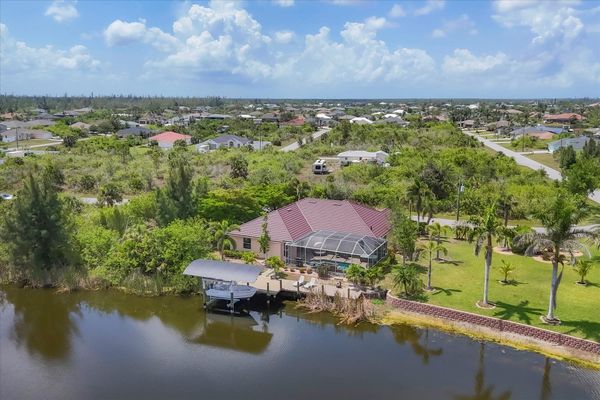 Beautiful South Gulf Cove home with private pool, hot tub, and canal access (Boat lift not available)