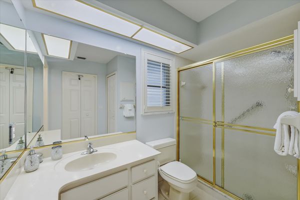 Primary bedroom attached bathroom with walk-in shower