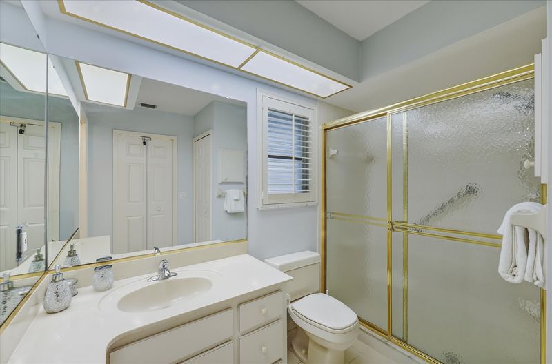 Primary bedroom attached bathroom with walk-in shower