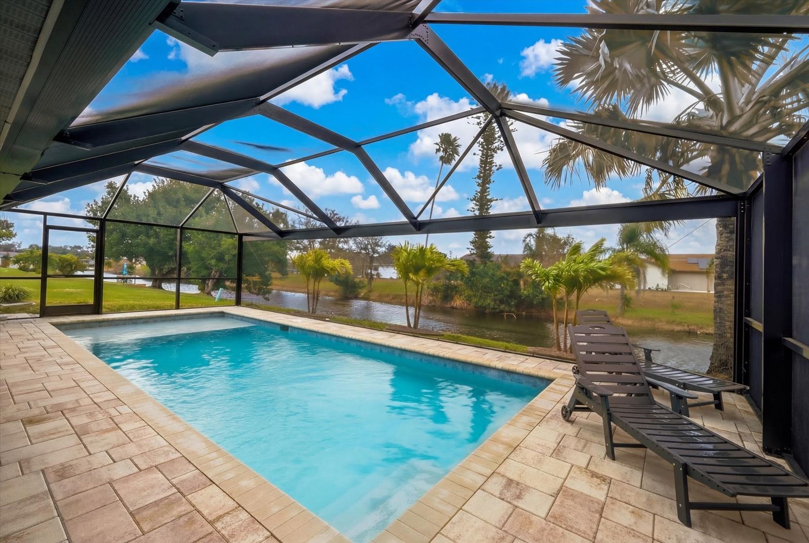 Sparkling private pool overlooking canal
