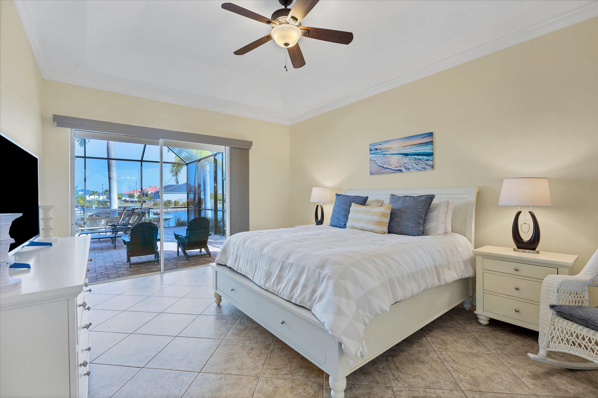 Airy primary bedroom with king bed