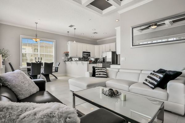 This modern living area has been designed with sophisticated black and white furnishings.