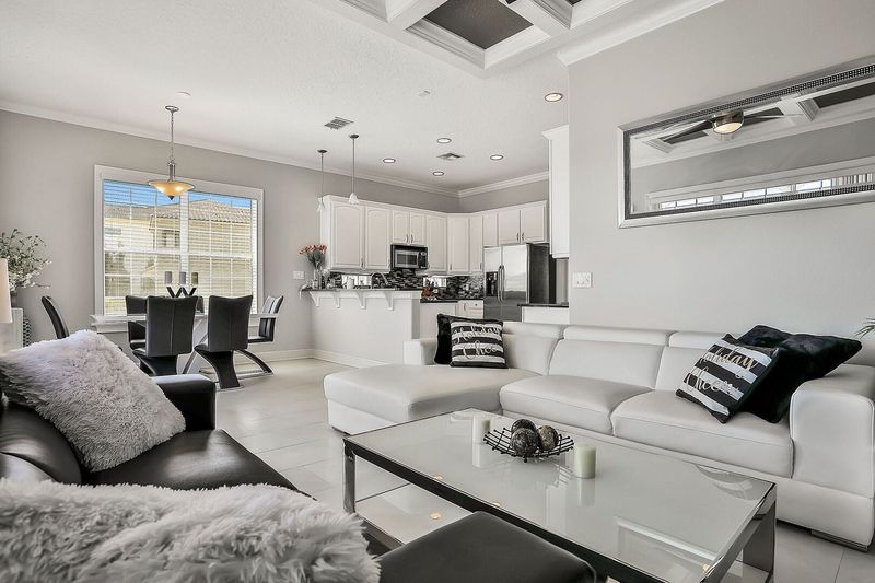 This modern living area has been designed with sophisticated black and white furnishings.