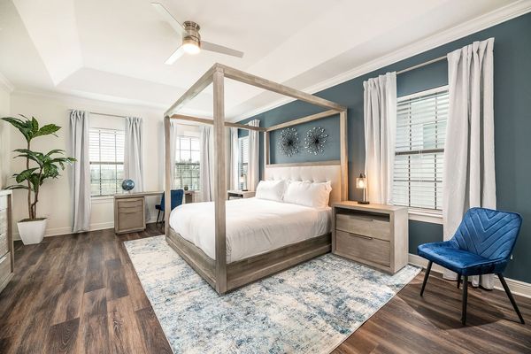 The rear master suite includes an en suite bathroom with shower and separate garden tub and a private balcony with breathtaking sunset views