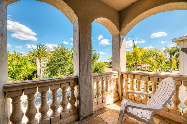 The galaxy-themed bedroom has a private balcony with neighborhood views