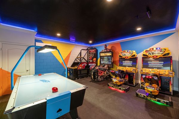 Challenge your family to friendly competition with air hockey, Miami Heat basketball, Terminator Salvation, and dual Super Bikes 2 racers