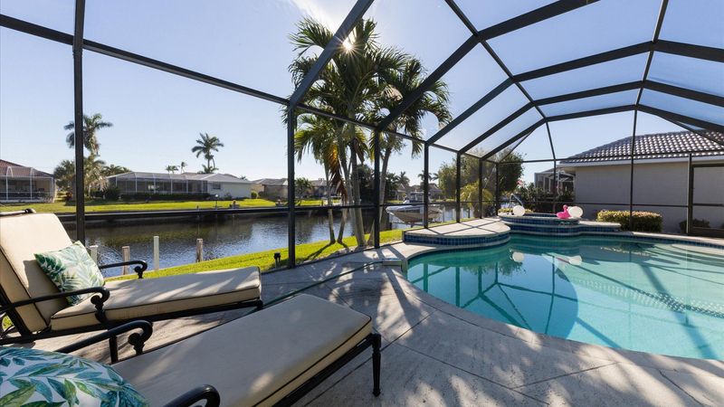Relax in the sunshine by the pool overlooking the canal (Boat lift not available)