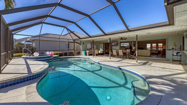 Gorgeous and spacious outdoor living spaces on the enclosed lanai with 49" x 28" smart TV