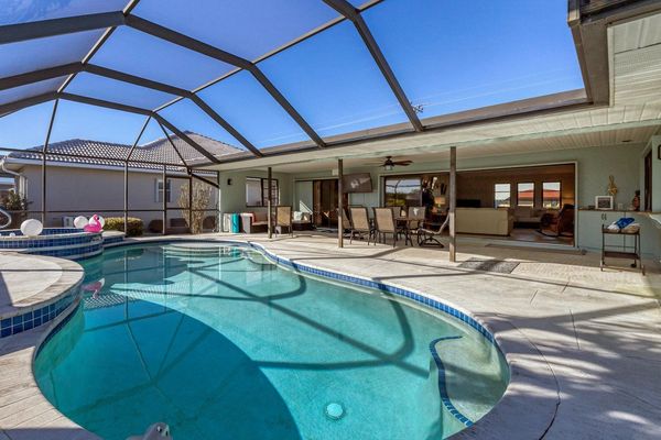 Gorgeous and spacious outdoor living spaces on the enclosed lanai with 49" x 28" smart TV