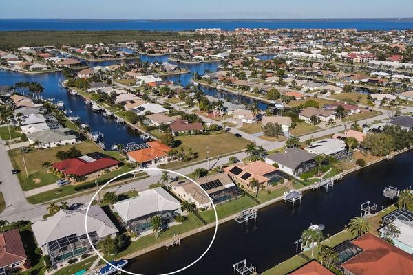 Aerial view of the house on canal and Charlotte Harbor just beyond (Boat lift not available)
