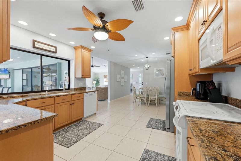 large, fully-equipped kitchen overlooking the lanai & pool