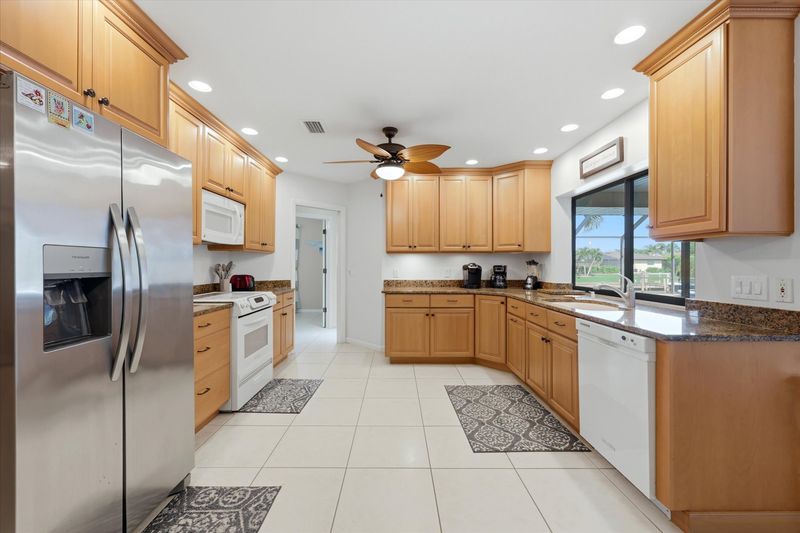 large, fully-equipped kitchen overlooking the lanai & pool