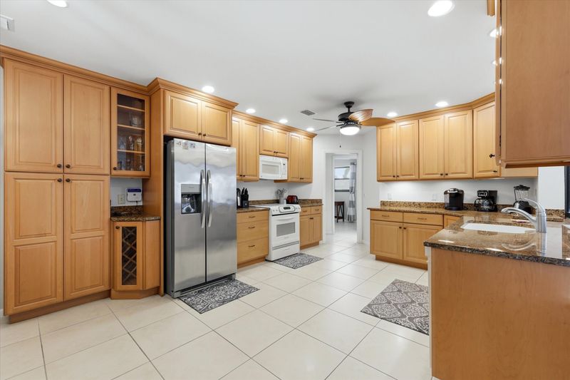 large, fully-equipped kitchen overlooking the lanai & pool