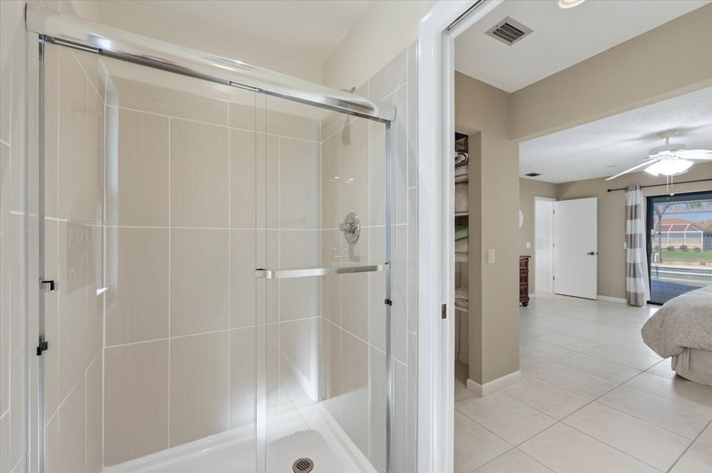Master bathroom ensuite with walk-in shower and double vanities