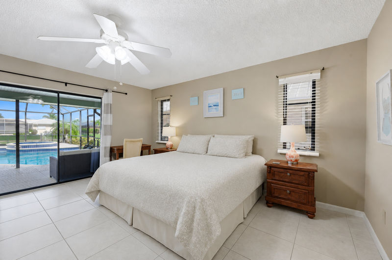 Primary bedroom with attached bathroom and lanai access