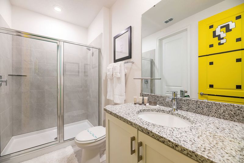 This en suite bathroom features a walk-in shower