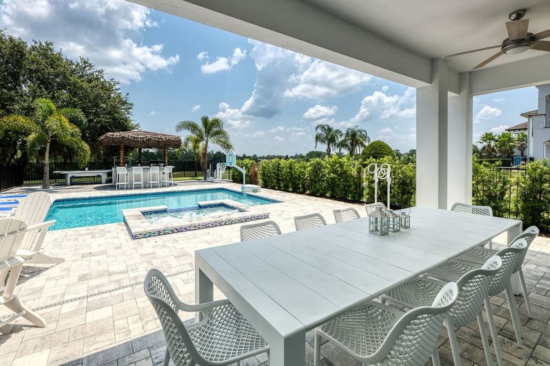 Dine al fresco at the outdoor dining table with seating for 10 on the lanai