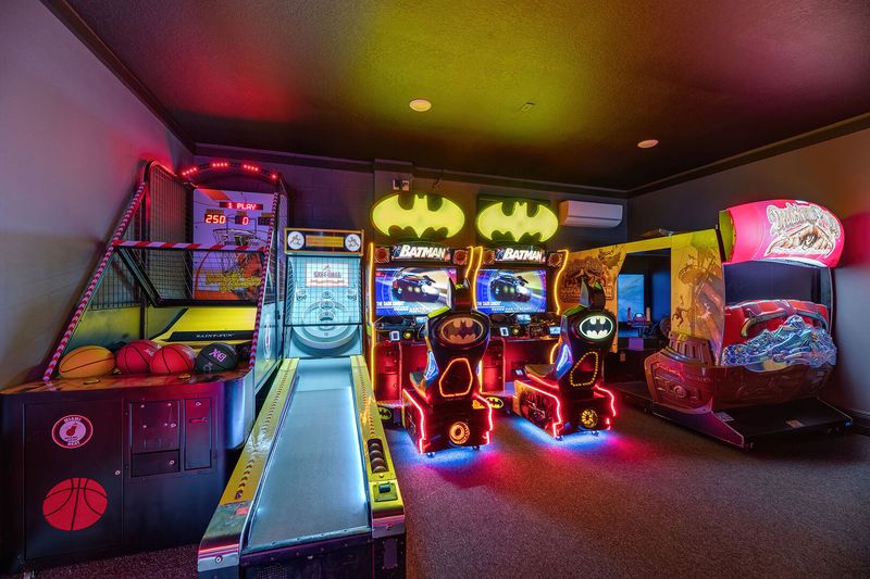 This exciting games room features Miami Heat basketball, skee-ball, a Fast and the Furious Super Bikes 2 racer, Deadstorm Pirates, dual Batman racers, and air hockey