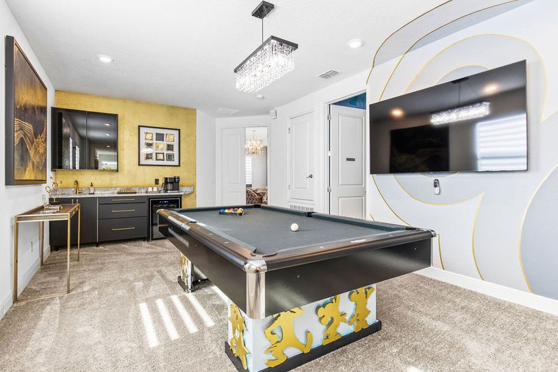 "Mickey's Dream" is the perfect hangout space with a pool table and large TV.