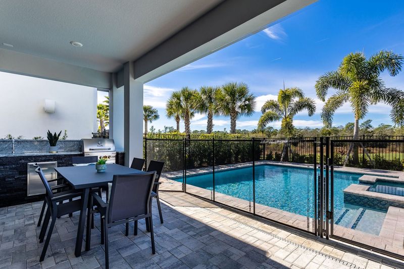 Step out onto your private lanai, grill up a great lunch with the summer kitchen with BBQ and enjoy your meal at your outdoor patio table.