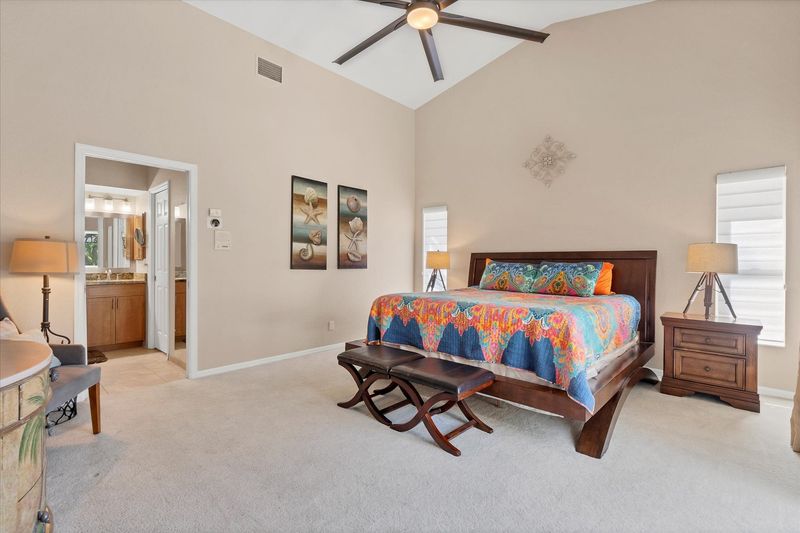 Primary bedroom with king bed, en suite bathroom and lanai access