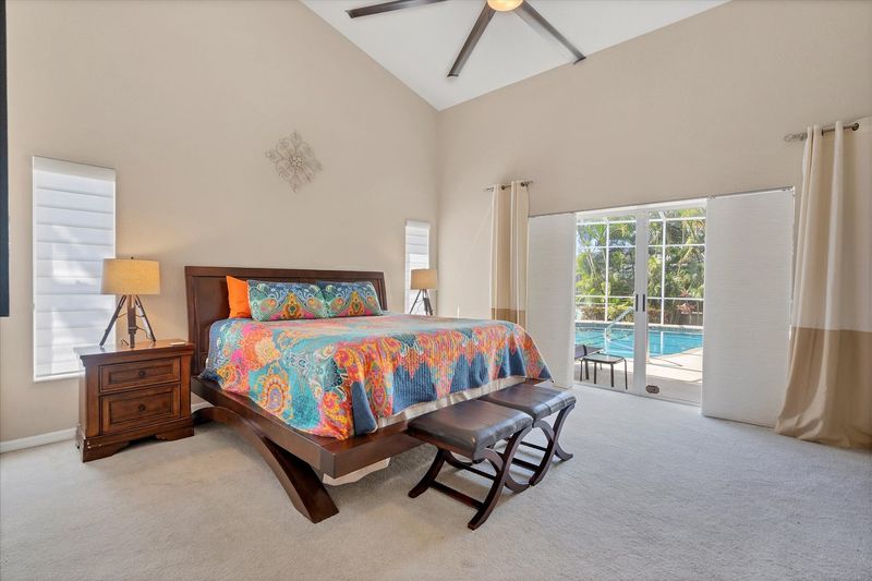 Primary bedroom with king bed, en suite and lanai access