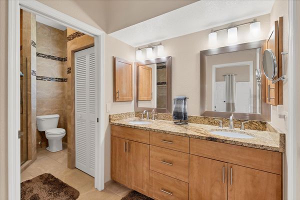En suite features a large walk-in shower and double vanities