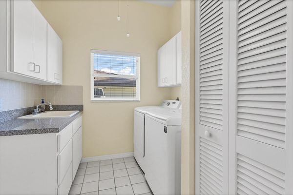 Laundry room with full-size washer and dryer