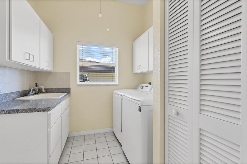Laundry room with full-size washer and dryer