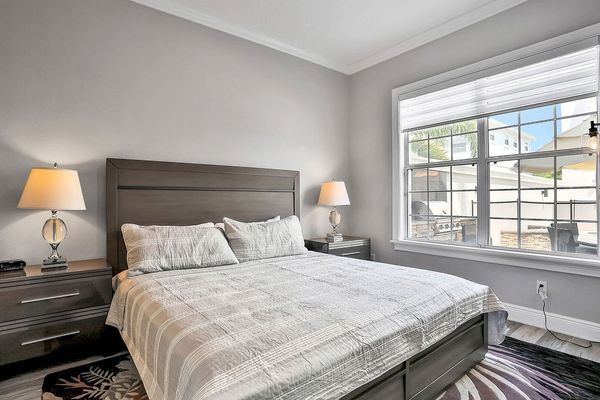This master suite on the ground floor features a king-sized bed