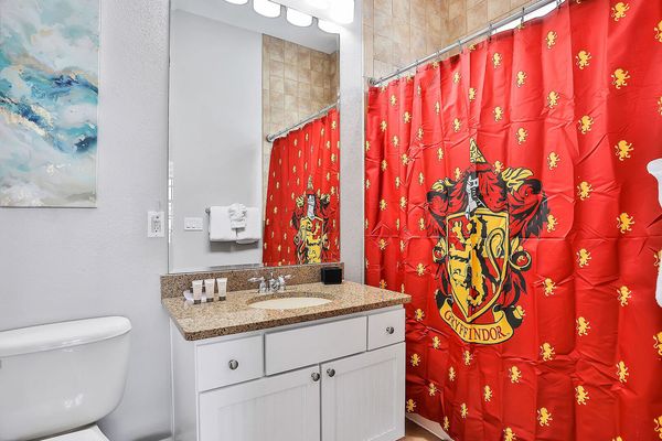 This en suite bathroom features a combined shower and tub