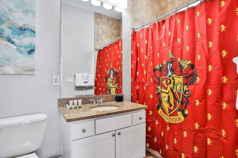 This en suite bathroom features a combined shower and tub