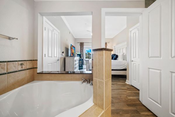 The master suite features a corner garden tub, perfect for unwinding after a day of adventures