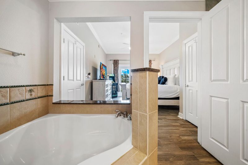 The master suite features a corner garden tub, perfect for unwinding after a day of adventures
