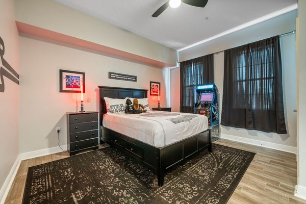 The galaxy-themed bedroom is sure to please with high attention to detail and a Star Wars Atari arcade