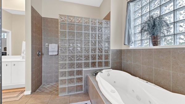 Master bathroom ensuite with giant tub