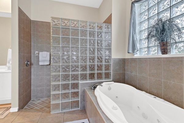 Master bathroom ensuite with giant tub
