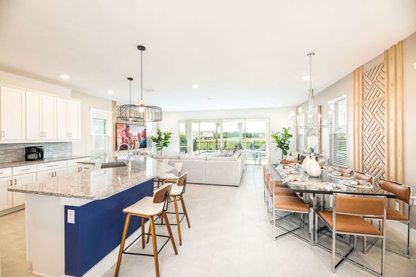 Step inside to the large open concept living area with modern, coastal-style furnishings