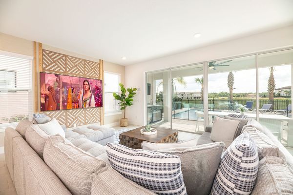 Gather the whole family together on the comfortable sectional sofa for a home movie on the 85-inch Smart TV