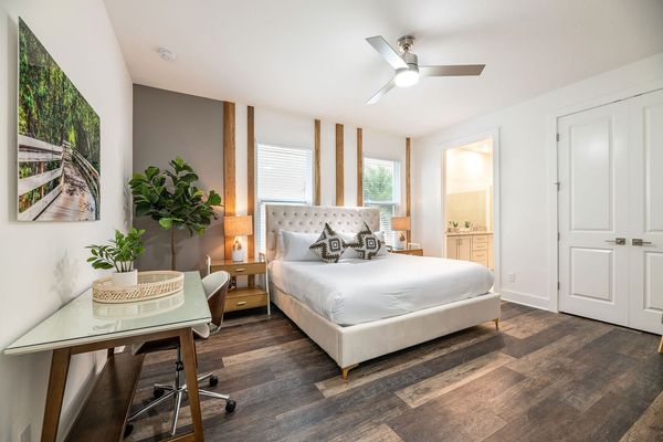 This ground floor master suite features a king-sized bed and en suite bathroom