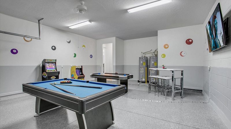 Game Room
65" Smart TV
Pool Table
Air Hockey
2 Video Arcades