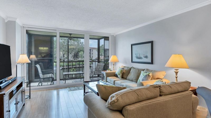 Bright and comfortable living room space with sleeper sofa