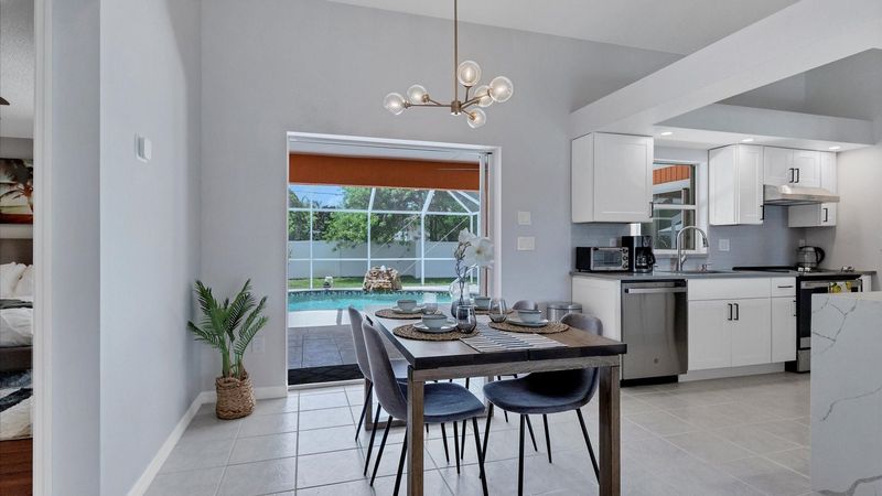 Enjoy a meal overlooking the beautiful lanai and pool.