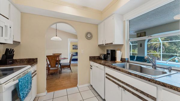 Spacious galley kitchen overlooking the pool