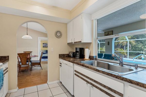 Spacious galley kitchen overlooking the pool