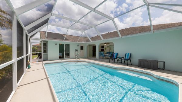 Spacious pool deck with a large pool