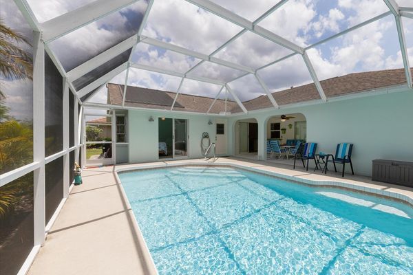Spacious pool deck with a large pool