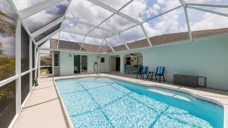 Spacious pool deck with a large pool
